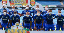 Jogadores do Grêmio usam máscaras para pedir suspensão de jogos